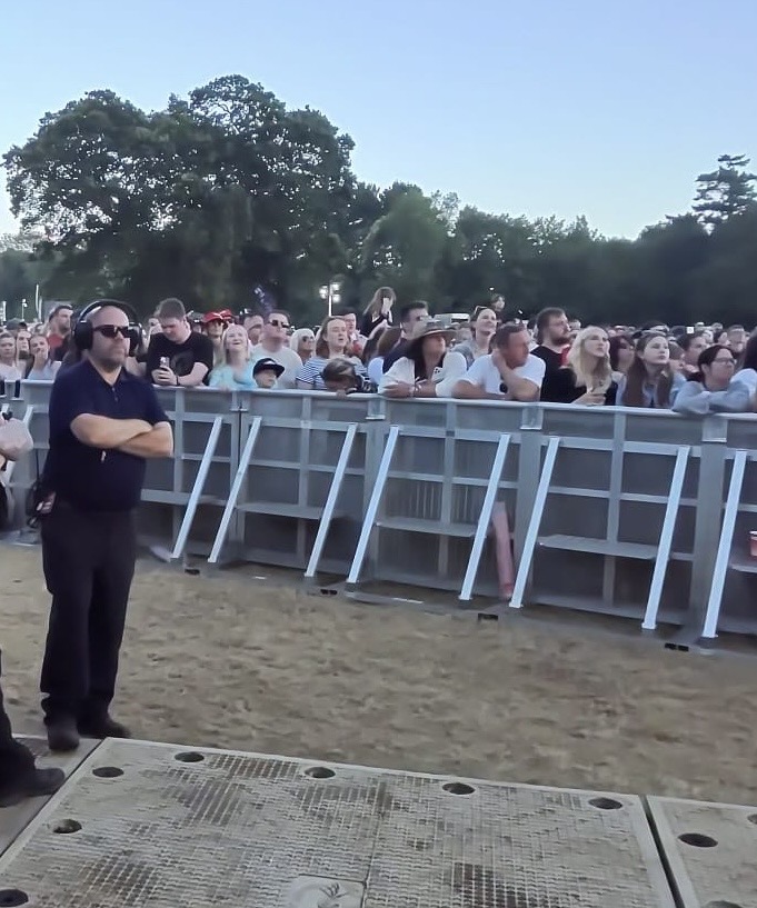 Dave Sammons working at the front of stage during a live event