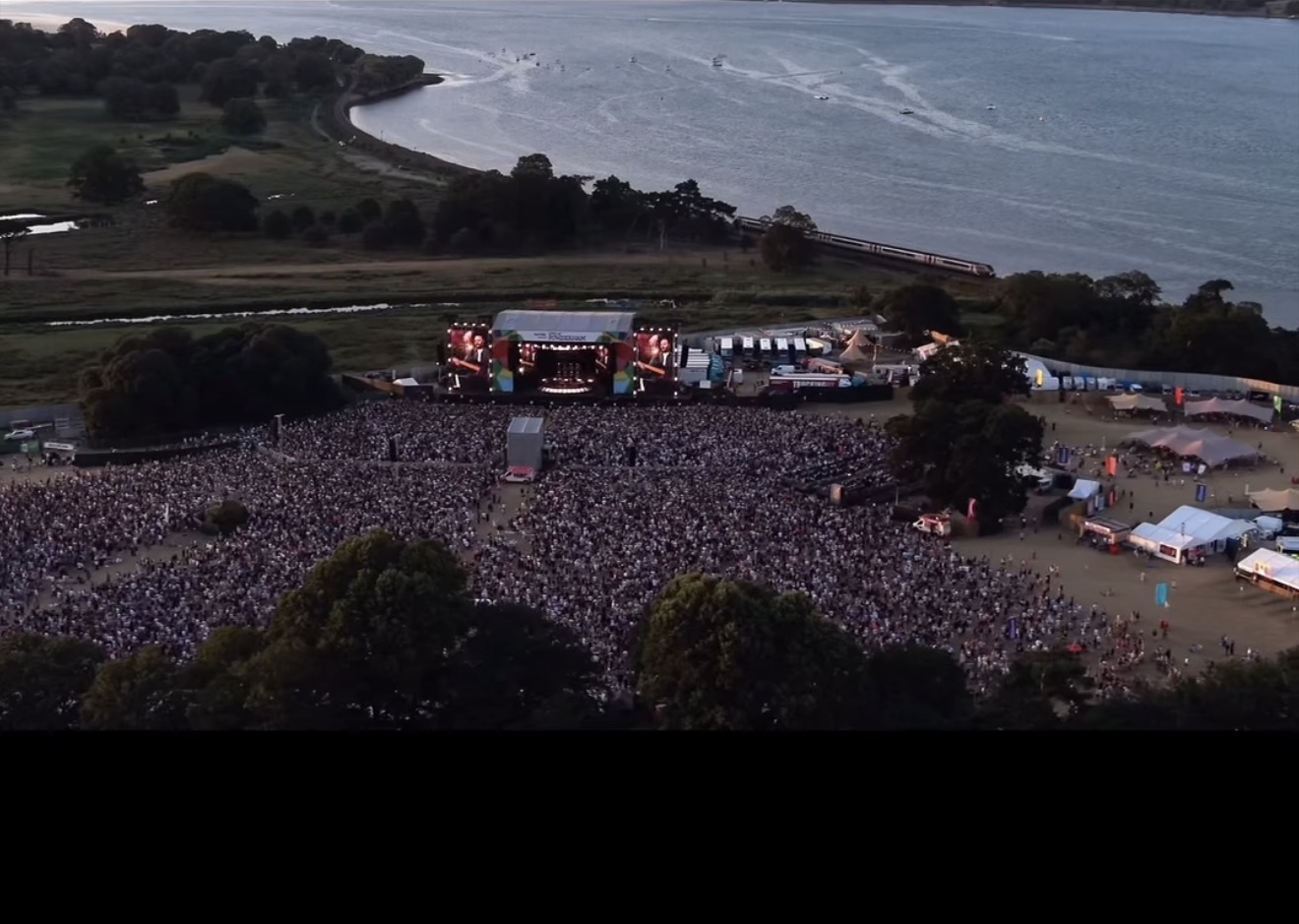 Large outdoor event audience viewed from above